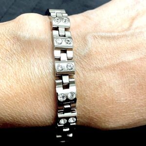 NWOT Gorgeous stainless steel link bracelet measuring 7”. 10 small CZ’s.